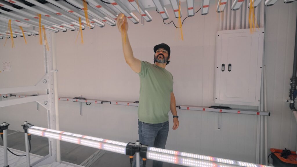 Nic looking at lighting fixtures in a facility